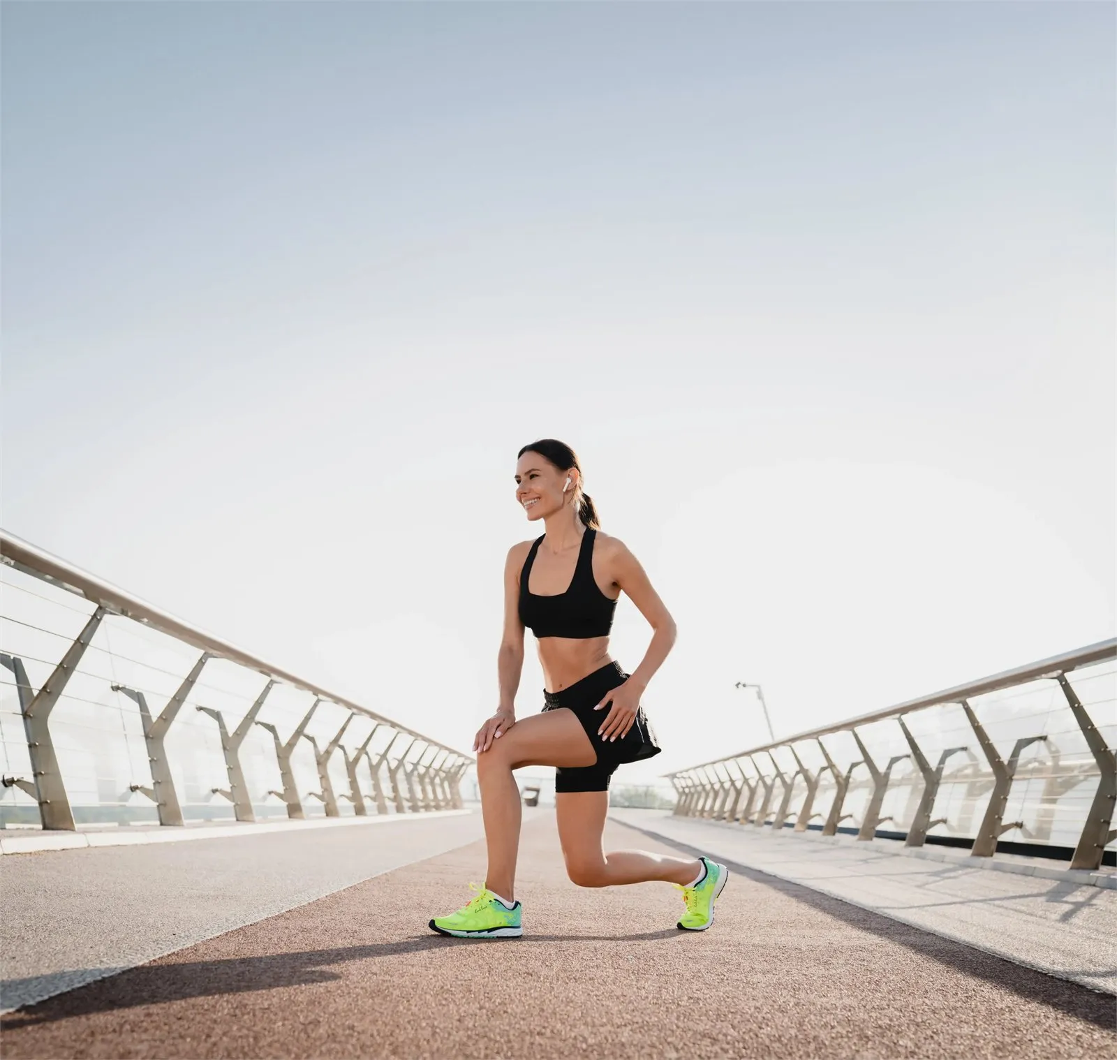 Runner stretching on an outdoor track