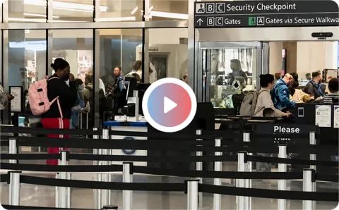 Travelers at an airport security checkpoint